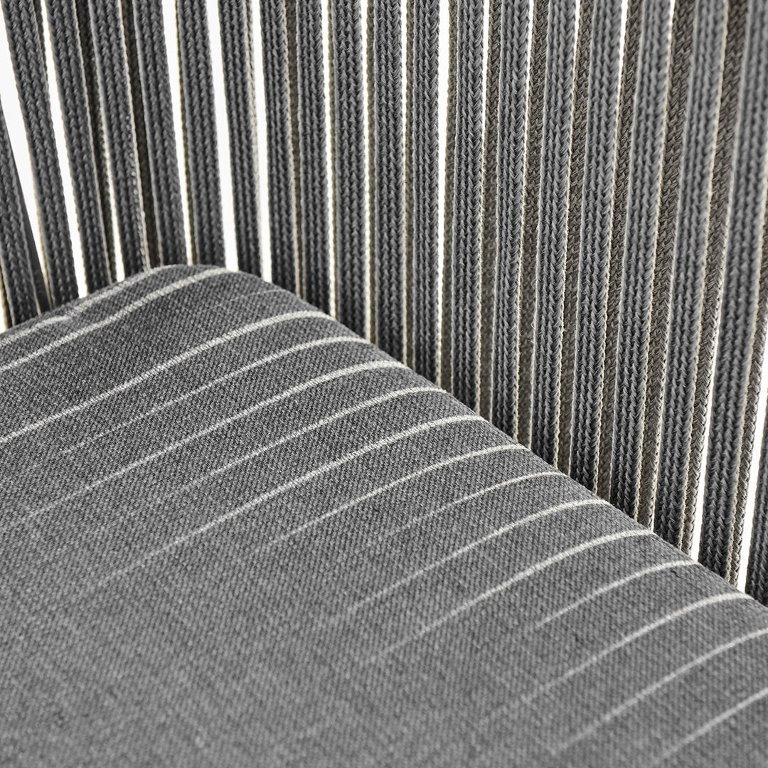 Gray and black striped fabric featuring varying widths of stripes for a modern look. Ideal for stylish upholstery.