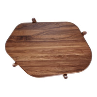 Wooden table with rich brown tones and unique, organic pattern featuring rounded edges and four legs.