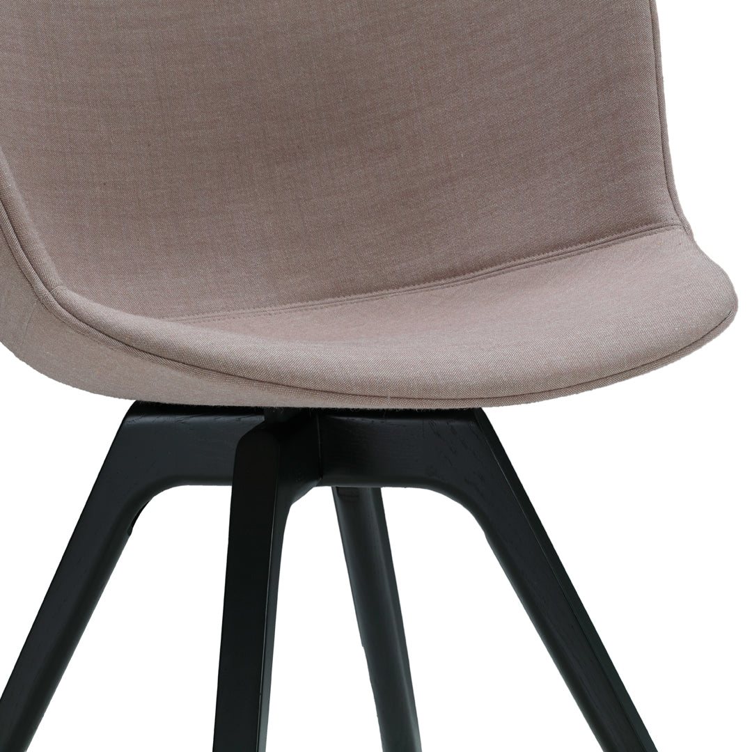 Soft beige fabric chair with a smooth texture, complemented by a sleek black wooden base. Ideal for modern decor.