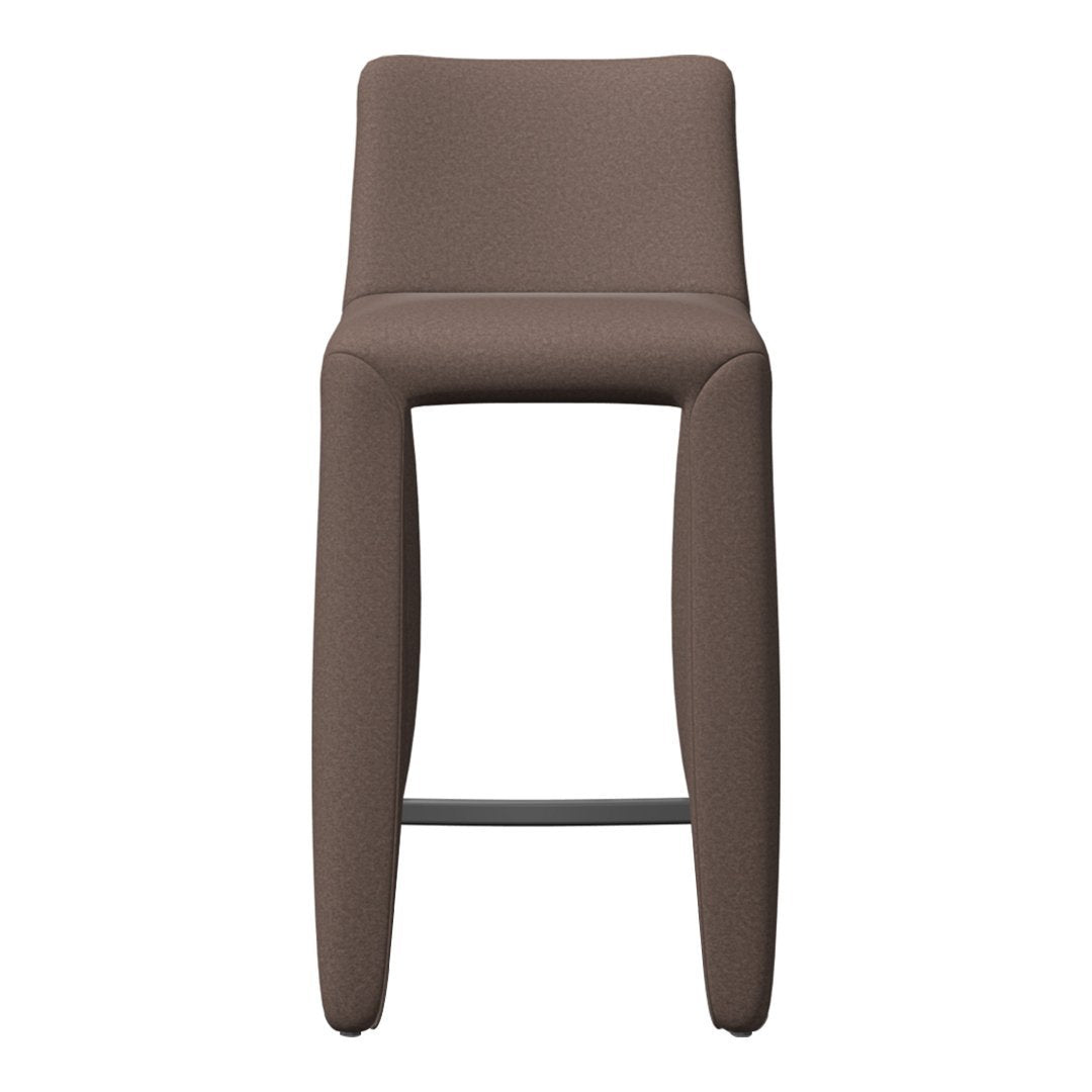 Brown upholstered bar stool with sleek, minimalist design and solid black metal footrest. Perfect for modern interiors.