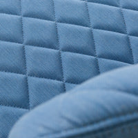 Textured quilted pattern in soft blue fabric, featuring diamond shapes and a smooth finish.