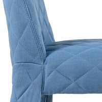 Quilted blue fabric chair with a soft texture and diamond pattern, perfect for stylish home décor.