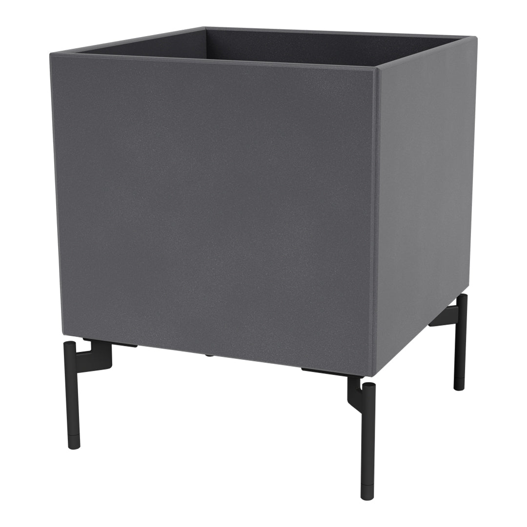 Gray planter box with a smooth finish and black metal legs, offering a modern minimalist design.