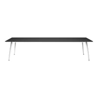 Sleek black tabletop with silver legs, modern and minimalist design perfect for any contemporary space.