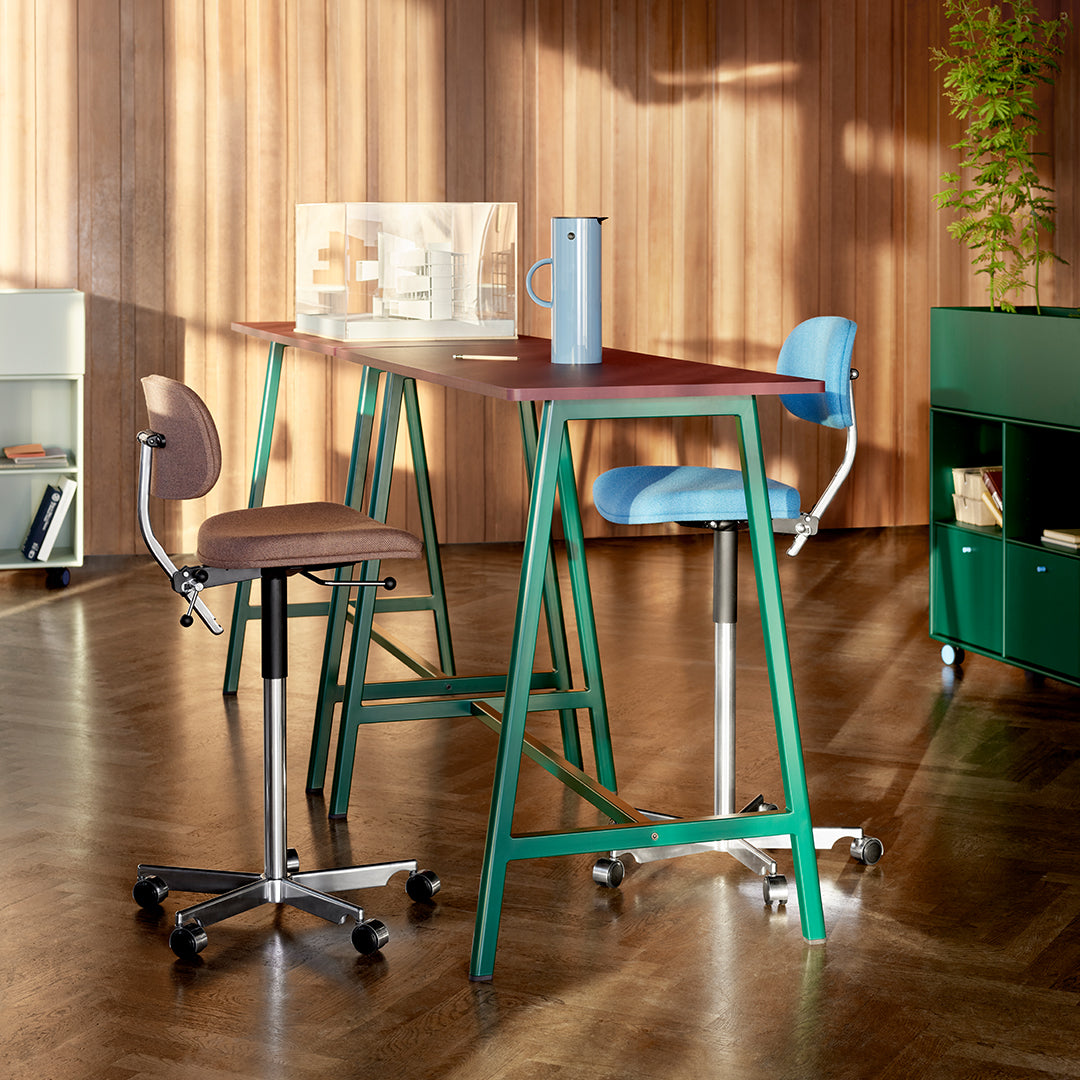 Colorful modern bar stools with blue, brown, and green accents, featuring sleek designs and contrasting patterns.