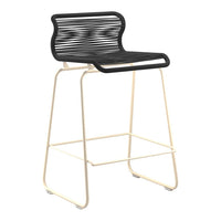 Black and cream bar stool with a stylish slatted pattern for modern decor. 