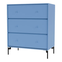 Blue three-drawer chest with smooth surface and subtle knob details, featuring black legs for contrast.