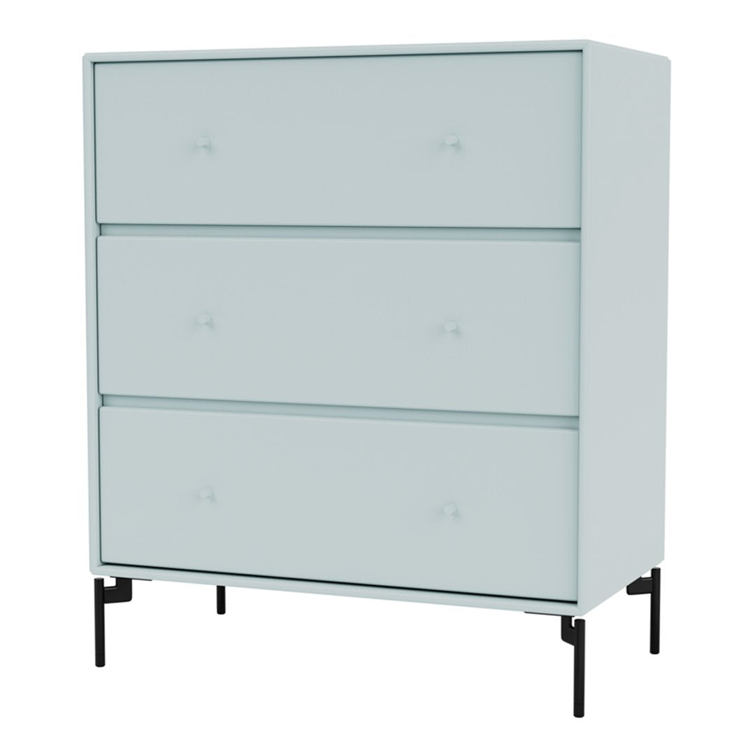 Light blue dresser with three smooth drawers and subtle patterns, set on sleek black legs.