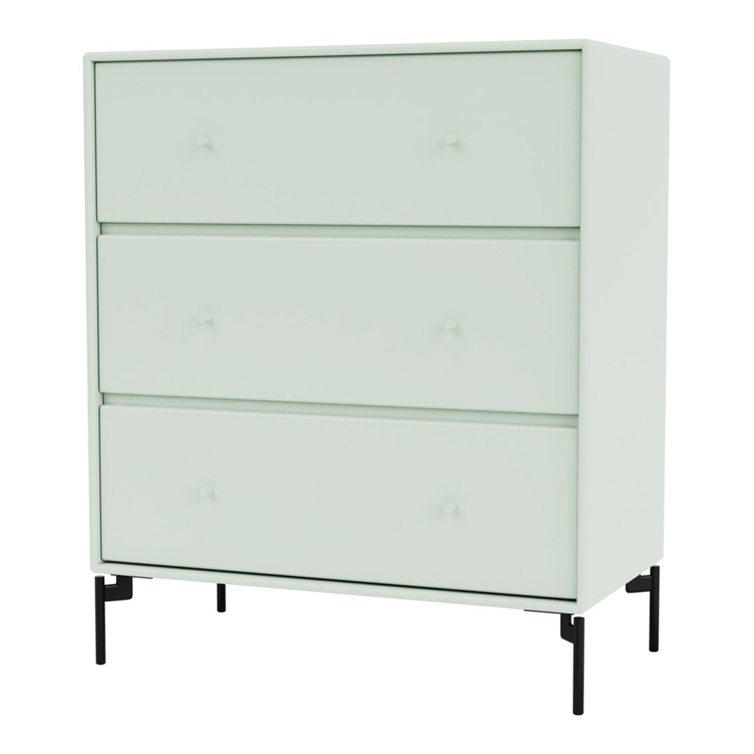 Light mint green dresser with smooth surfaces and minimalist design, featuring subtle knob accents and black legs.