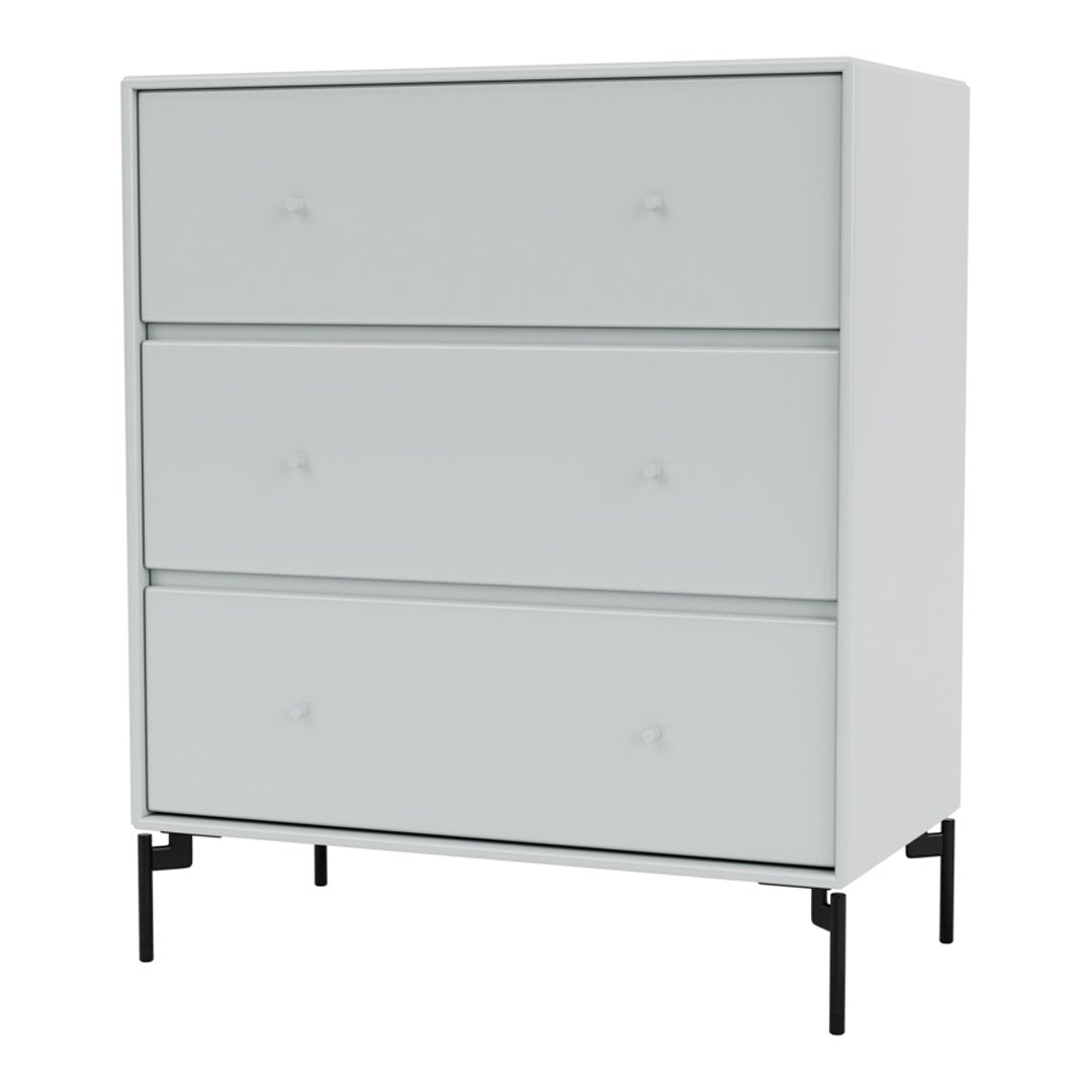 Modern white dresser with sleek drawers and minimalist black legs, creating a stylish, contemporary look.