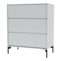 Modern white dresser with sleek drawers and minimalist black legs, creating a stylish, contemporary look.