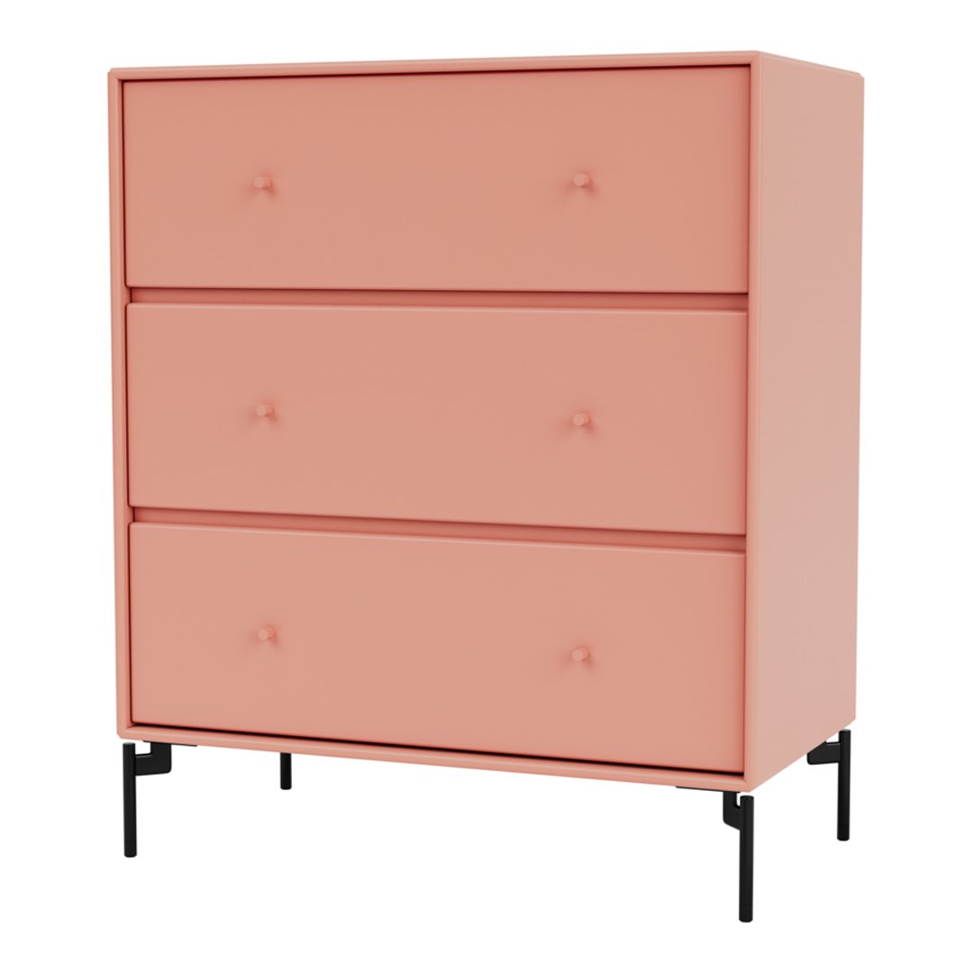 Blush pink dresser with three drawers and stylish black legs, featuring a smooth, minimalistic design.