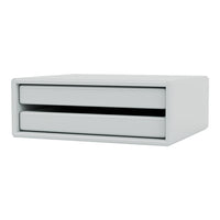 Minimalist white storage drawer with smooth, sleek surfaces and contrasting black drawer openings.