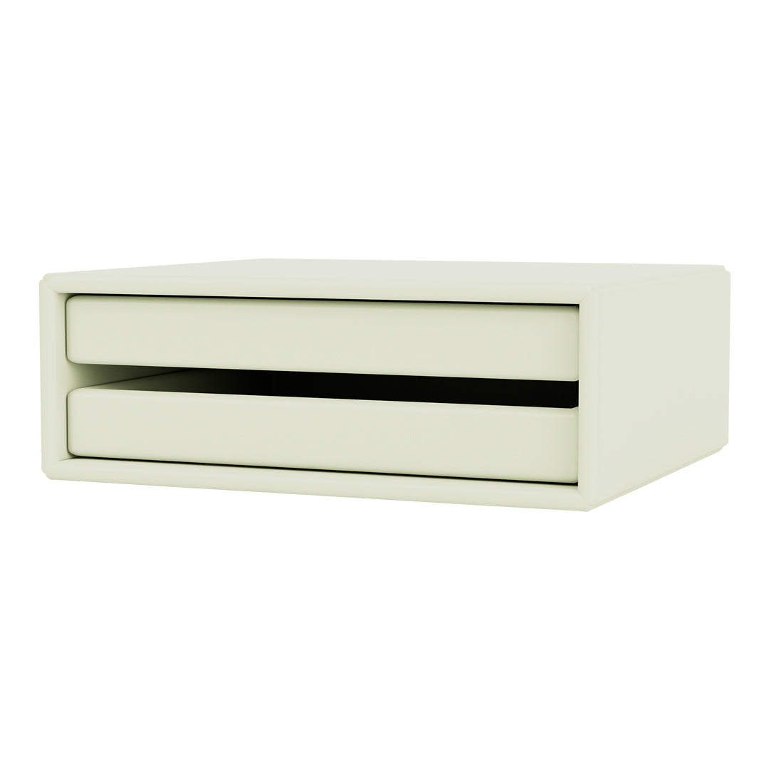 Light green storage drawer with smooth surface and modern design, featuring two drawers and a sleek black accent.