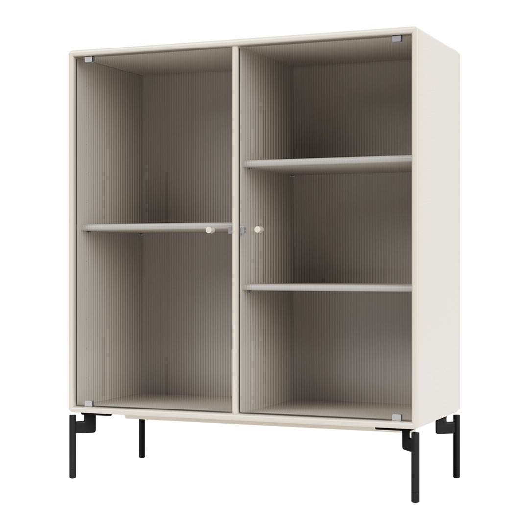 Light beige cabinet with ribbed pattern and sleek black legs, designed for modern storage solutions.