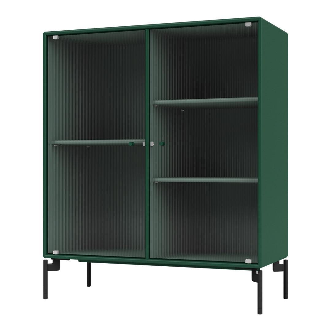 Green ribbed cabinet with a sleek design and black metal legs, showcasing a minimalist and modern aesthetic.