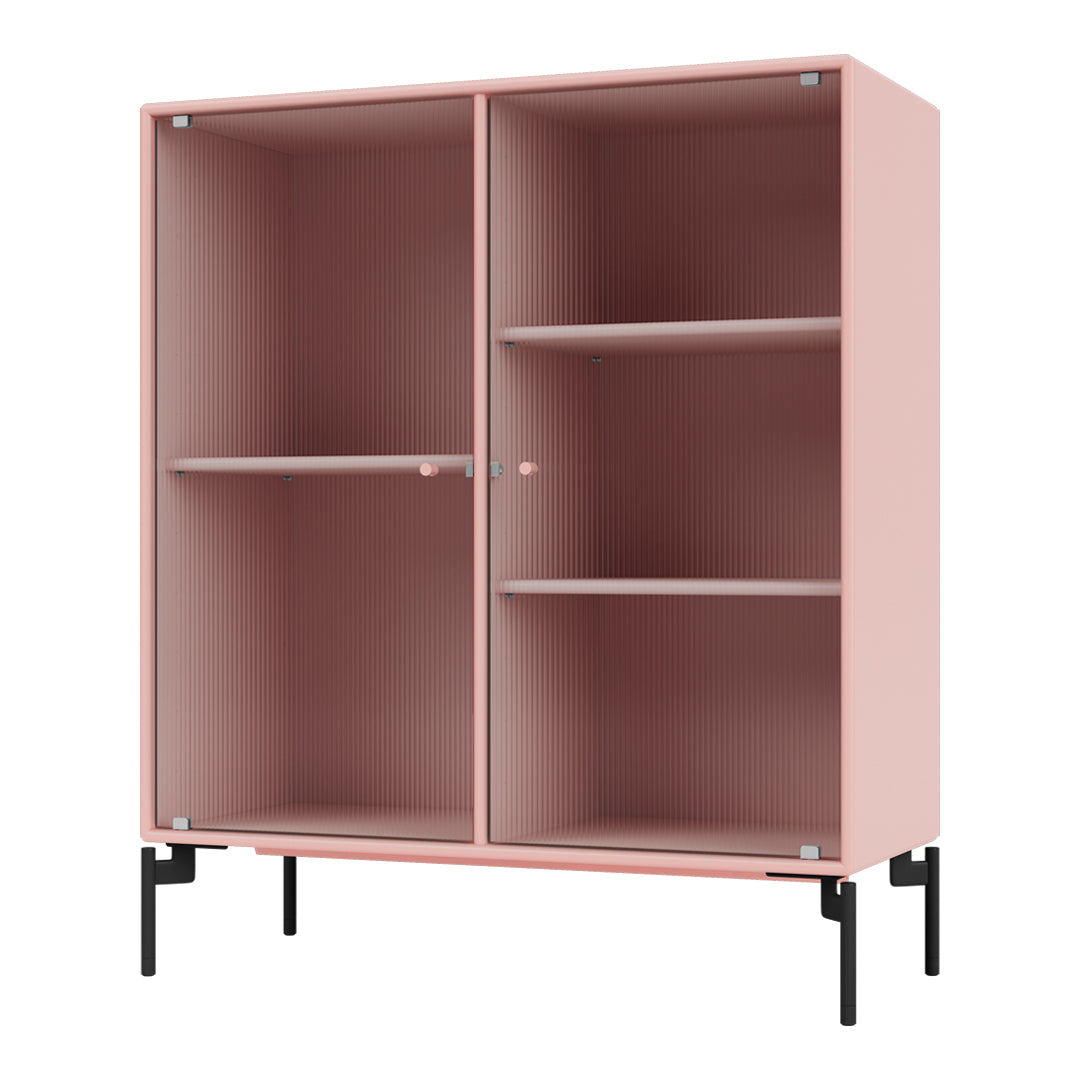 Pink ribbed cabinet with black metal legs, featuring a clean and modern design for stylish storage solutions.