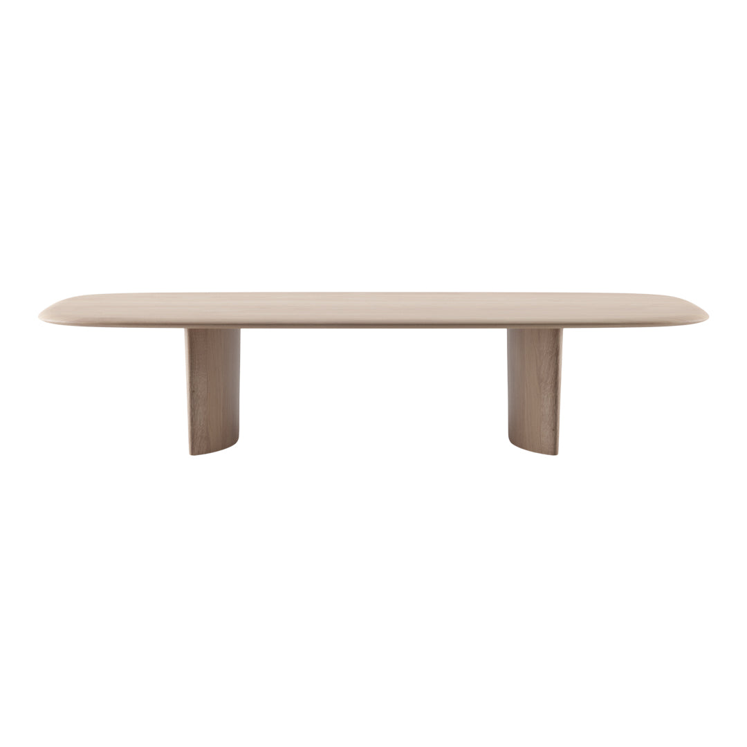 Light beige dining table with a smooth, oval top and rounded edges, complemented by solid wood legs.