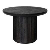 Round black wood table with textured, patterned surface and vertical striped pedestal base.