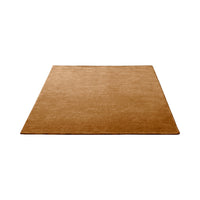 Plain brown area rug in a warm, neutral hue with a soft texture, perfect for versatile home decor.
