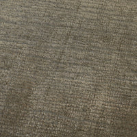 Textured gray area rug featuring subtle earth-toned patterns for a sophisticated, modern look.