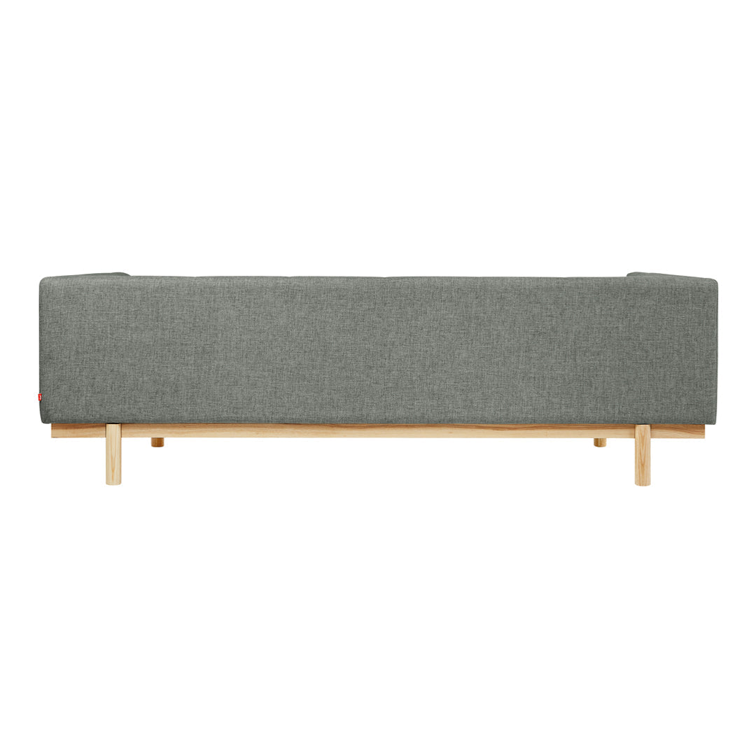 Gray upholstered sofa with a sleek design and natural wooden legs. Perfect for modern decor.