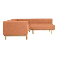 Orange upholstered sectional sofa with a textured pattern and light wooden legs. Ideal for modern living spaces.