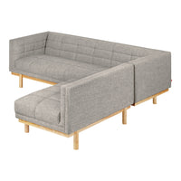 Gray tufted sectional sofa with wooden legs, featuring a minimalist design and clean lines. Perfect for modern decor.