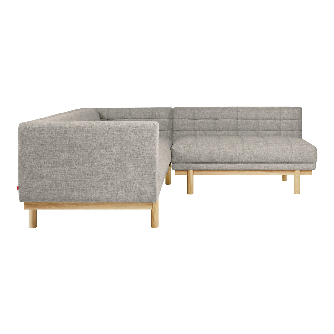 Gray fabric sectional sofa with a grid pattern and light wooden legs, perfect for modern living spaces.