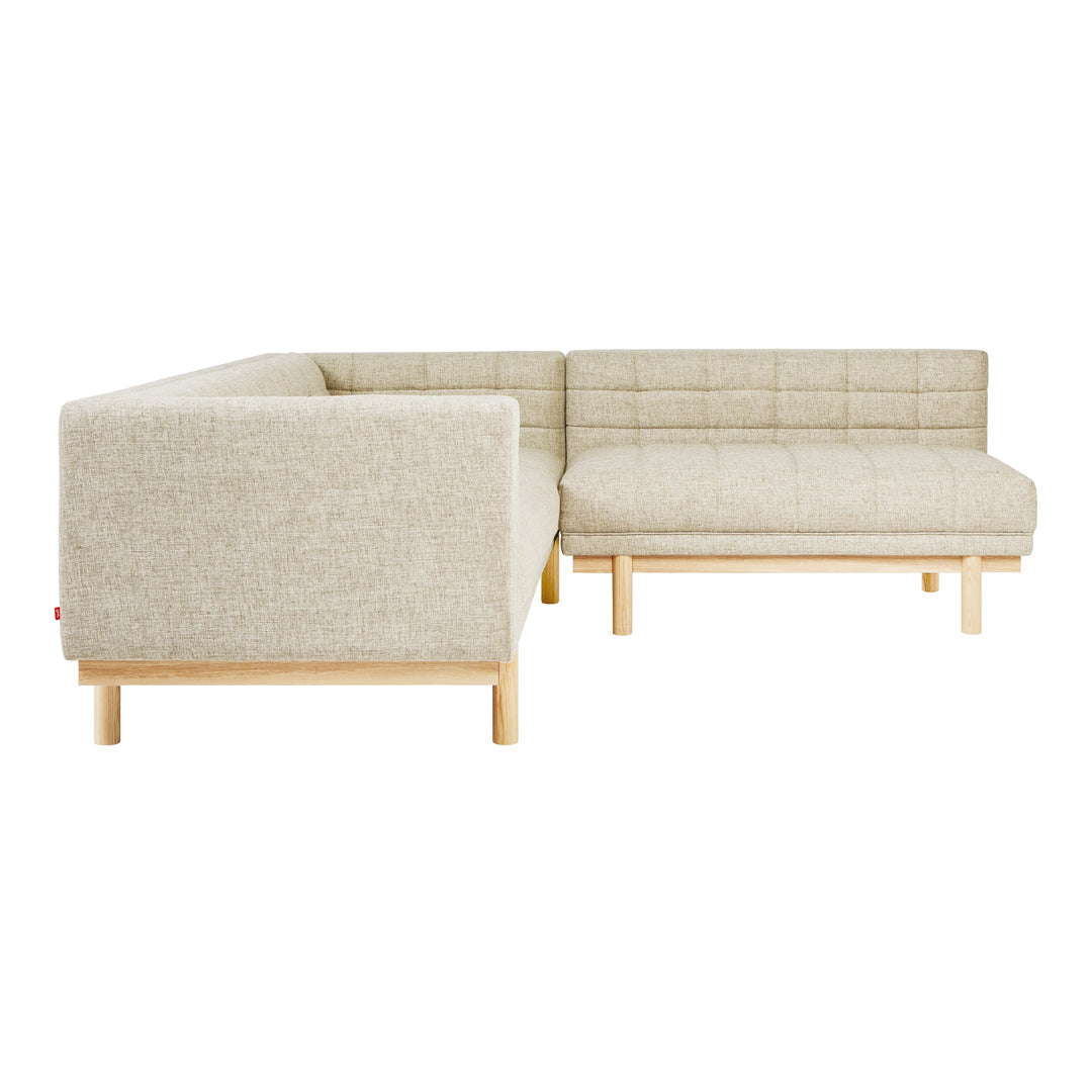 Linen beige sofa with a quilted pattern and light wood legs, perfect for modern living spaces.