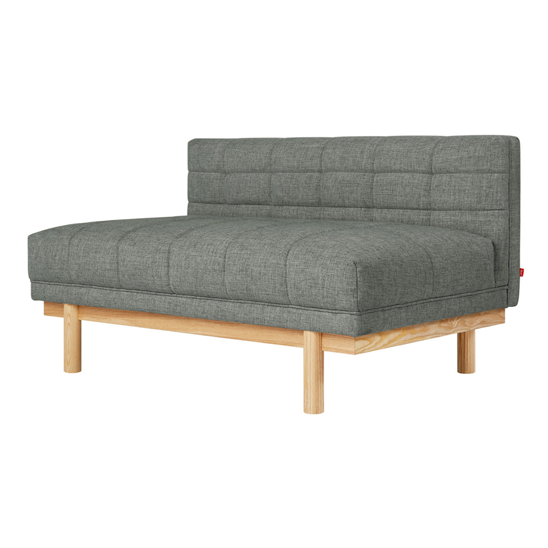 Gray tufted sofa with a sleek design and natural wood legs, perfect for modern decor.