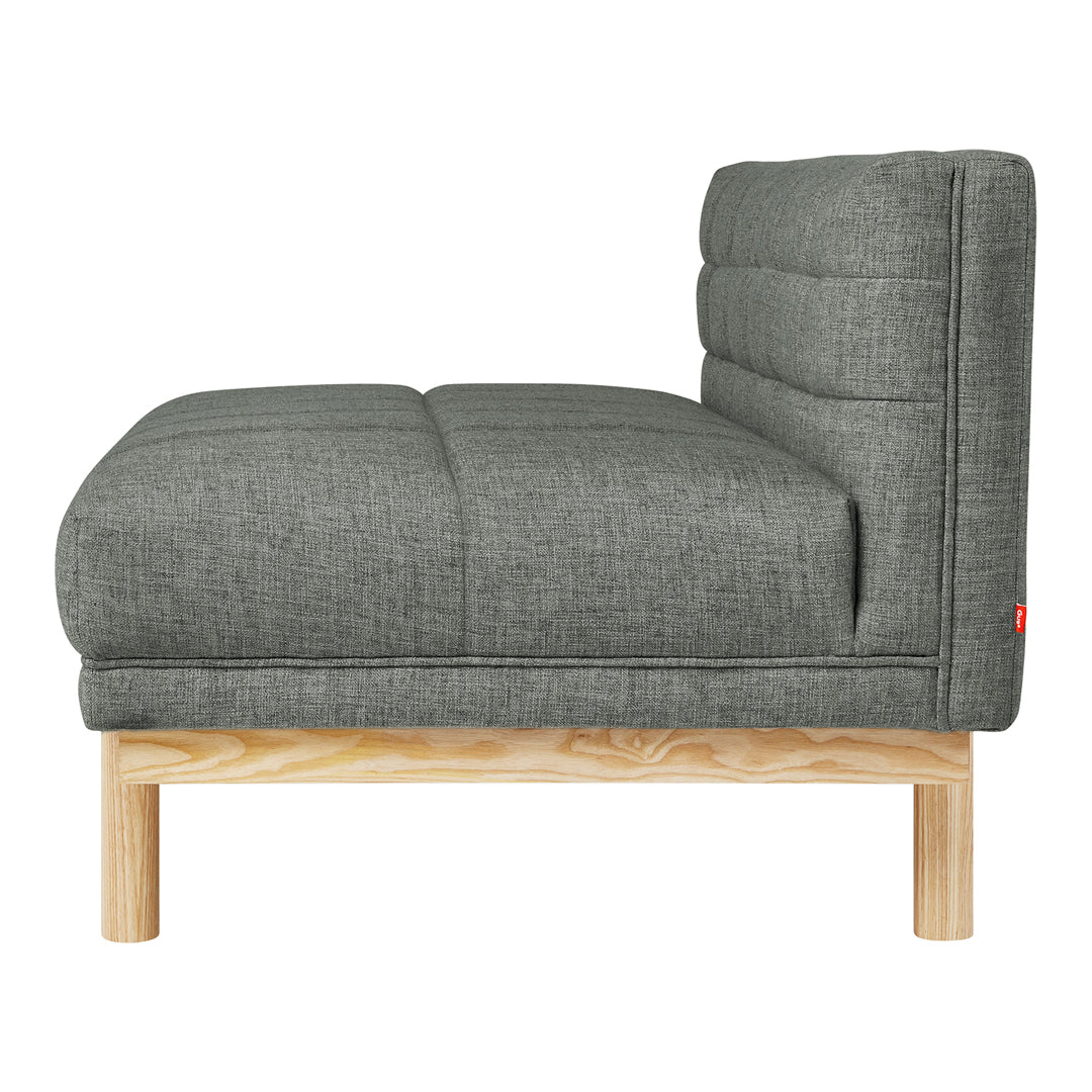Gray tufted fabric sofa with a sleek wooden base, showcasing a modern, minimalistic design.