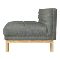 Gray tufted fabric sofa with a sleek wooden base, showcasing a modern, minimalistic design.