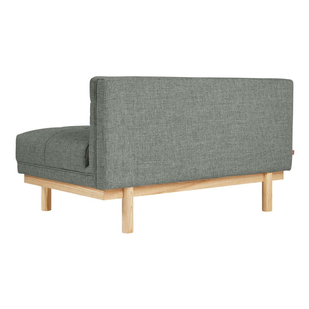 Gray textured fabric couch with a minimalist wooden frame. Modern design with clean lines and simple elegance.