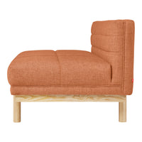 Rust-colored upholstered chair with a tufted pattern and natural wood frame, perfect for modern decor.