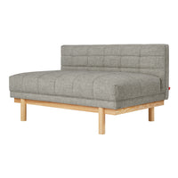 Gray tufted fabric sofa with a minimalist wood base, showcasing a modern aesthetic and sleek design.