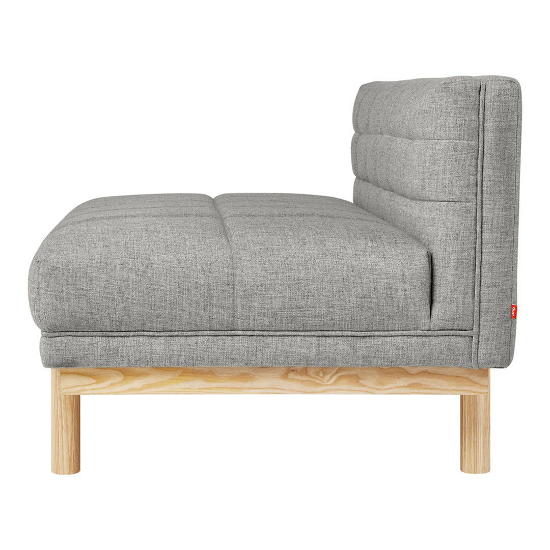 Gray upholstered sofa with a tufted design and light wooden legs, adding modern elegance to any space.