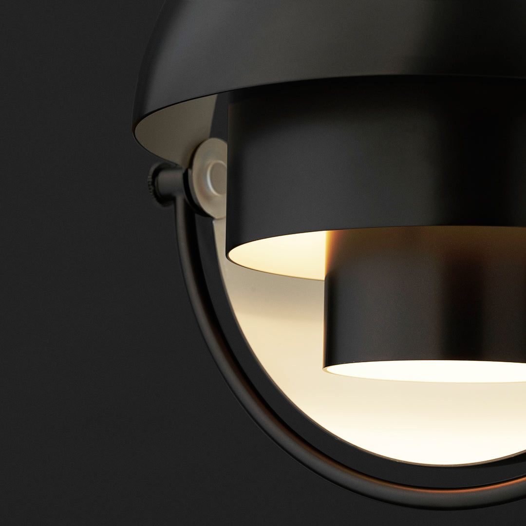 Black and gold modern pendant lamp with sleek geometric patterns and a matte finish. Ideal for contemporary decor.