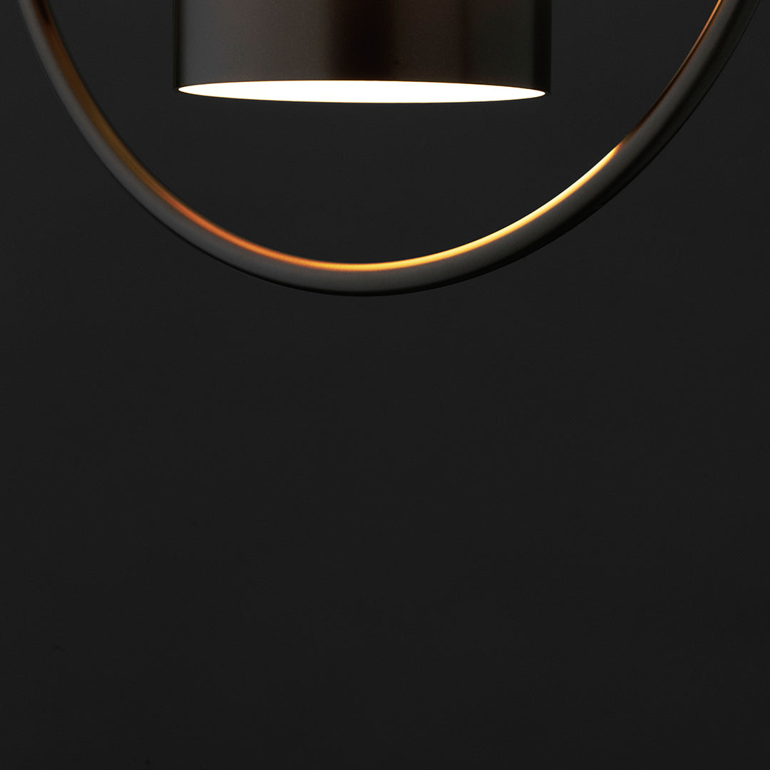 Modern black pendant light with a metallic gold circular accent and sleek, minimal design. Perfect for contemporary decor.