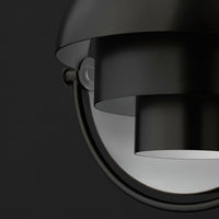 Black metal pendant light with sleek modern design and smooth, circular patterns. 