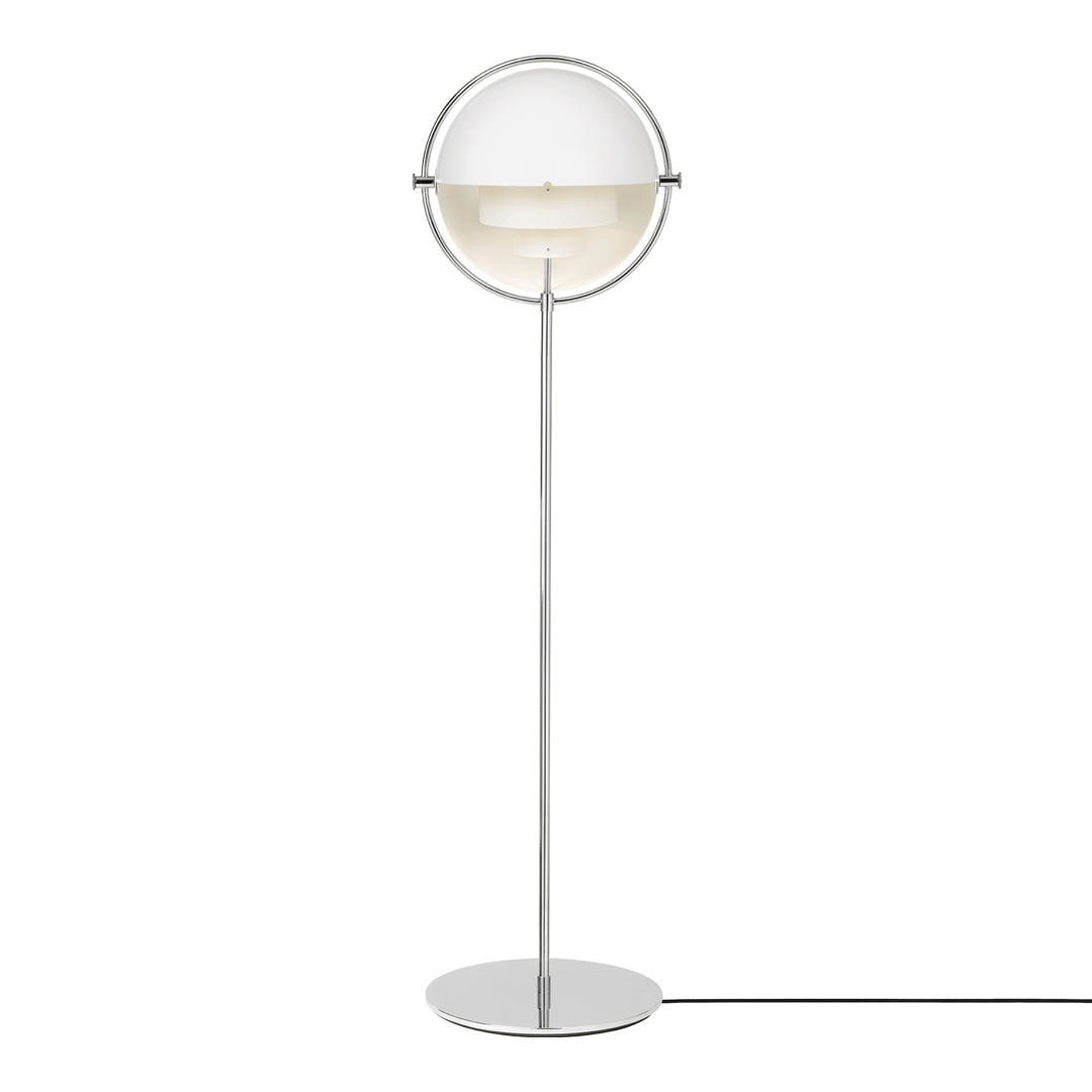 Modern floor lamp featuring a sleek silver base and a round, translucent white shade for a minimalist look.
