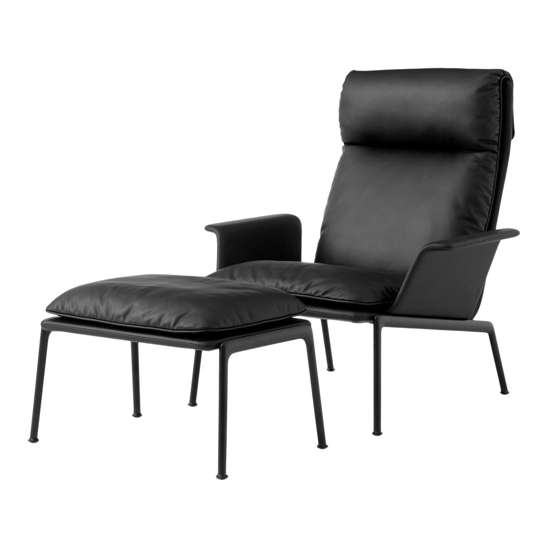 Black leather armchair with matching ottoman on a sleek metal frame, showcasing minimalist design and modern elegance.