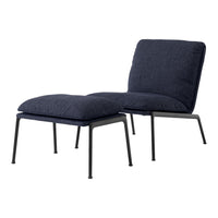 Navy blue upholstered lounge chair with a minimalist black metal frame and soft, textured cushions.