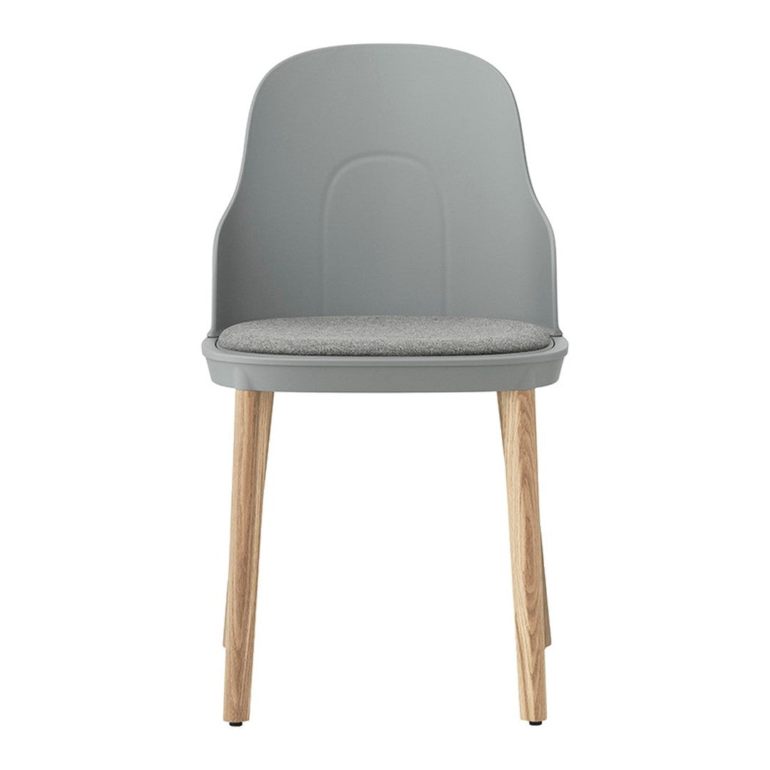 Gray dining chair with a cushioned seat and natural wood legs. Modern design with a sleek, minimalist style.