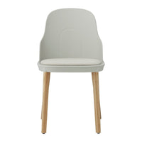 Light gray chair with a smooth finish and natural wood legs. Stylish and modern design for any space.