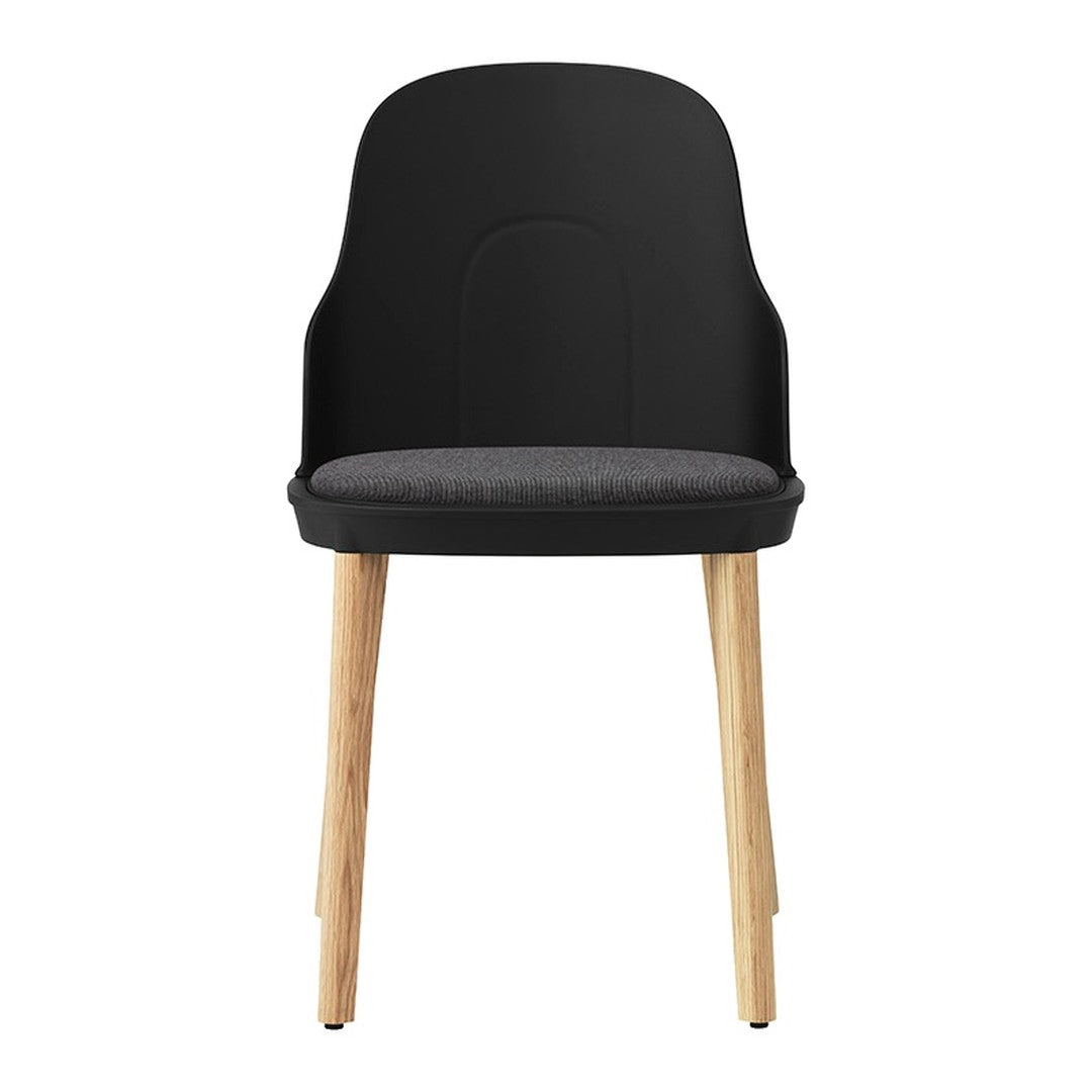 Sleek black chair with a gray cushion and natural wood legs, offering a modern and minimalist design.