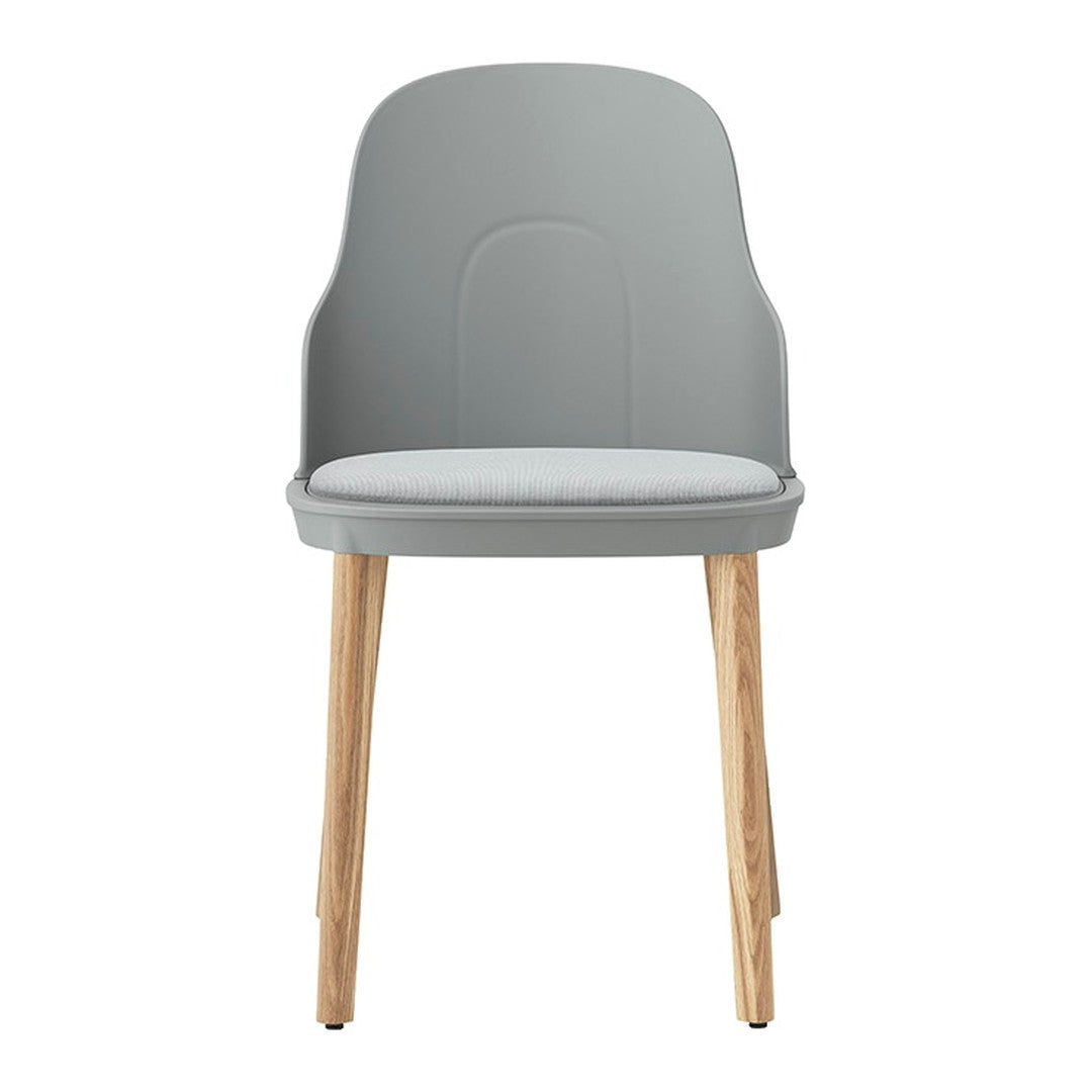 Modern gray chair with a smooth, minimalist design and light wood legs. Stylish and versatile for any space.