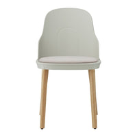 Light gray chair with a soft pink seat cushion and natural wood legs. Minimalist design for modern spaces.