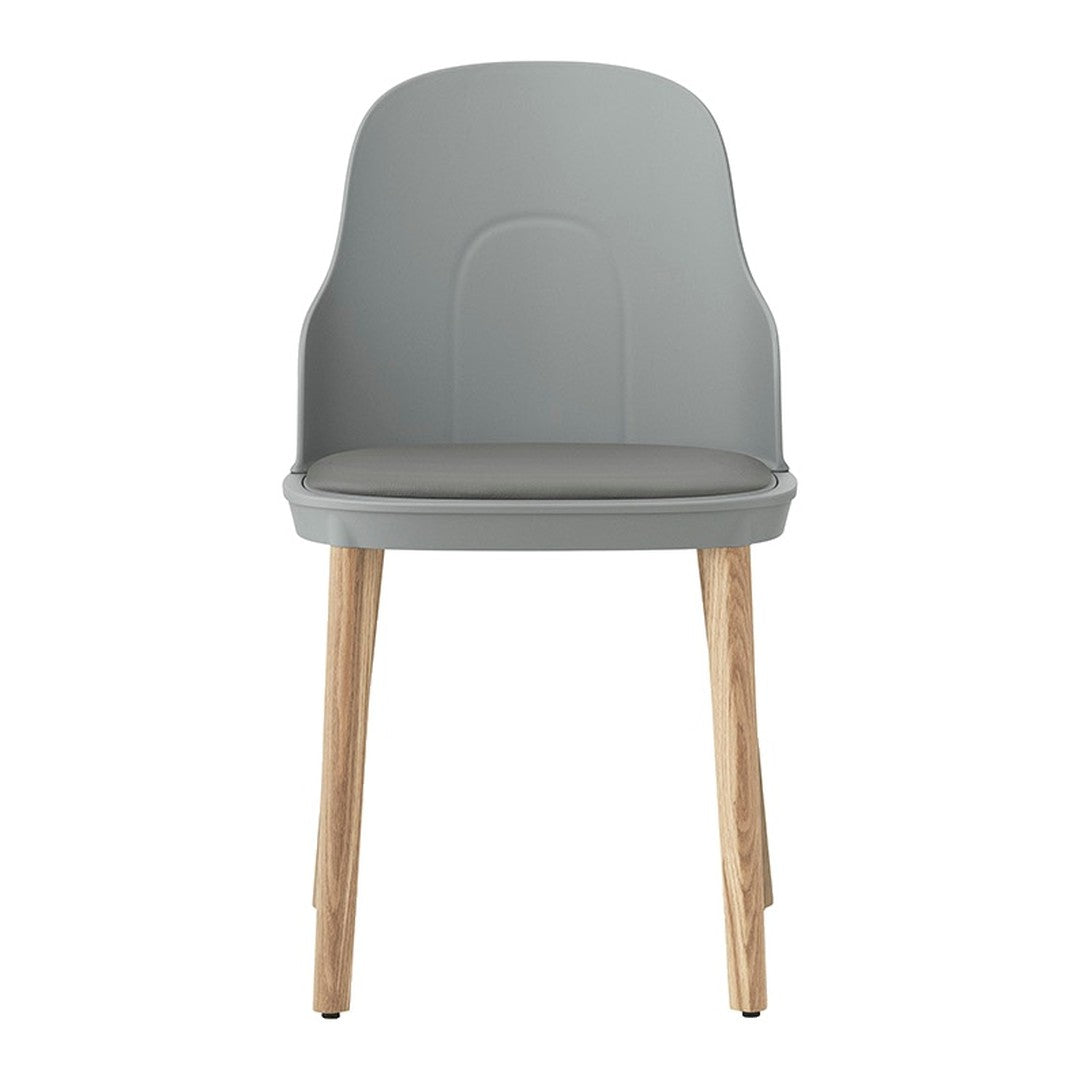 Modern gray chair with sleek lines and natural wood legs, perfect for contemporary decor.