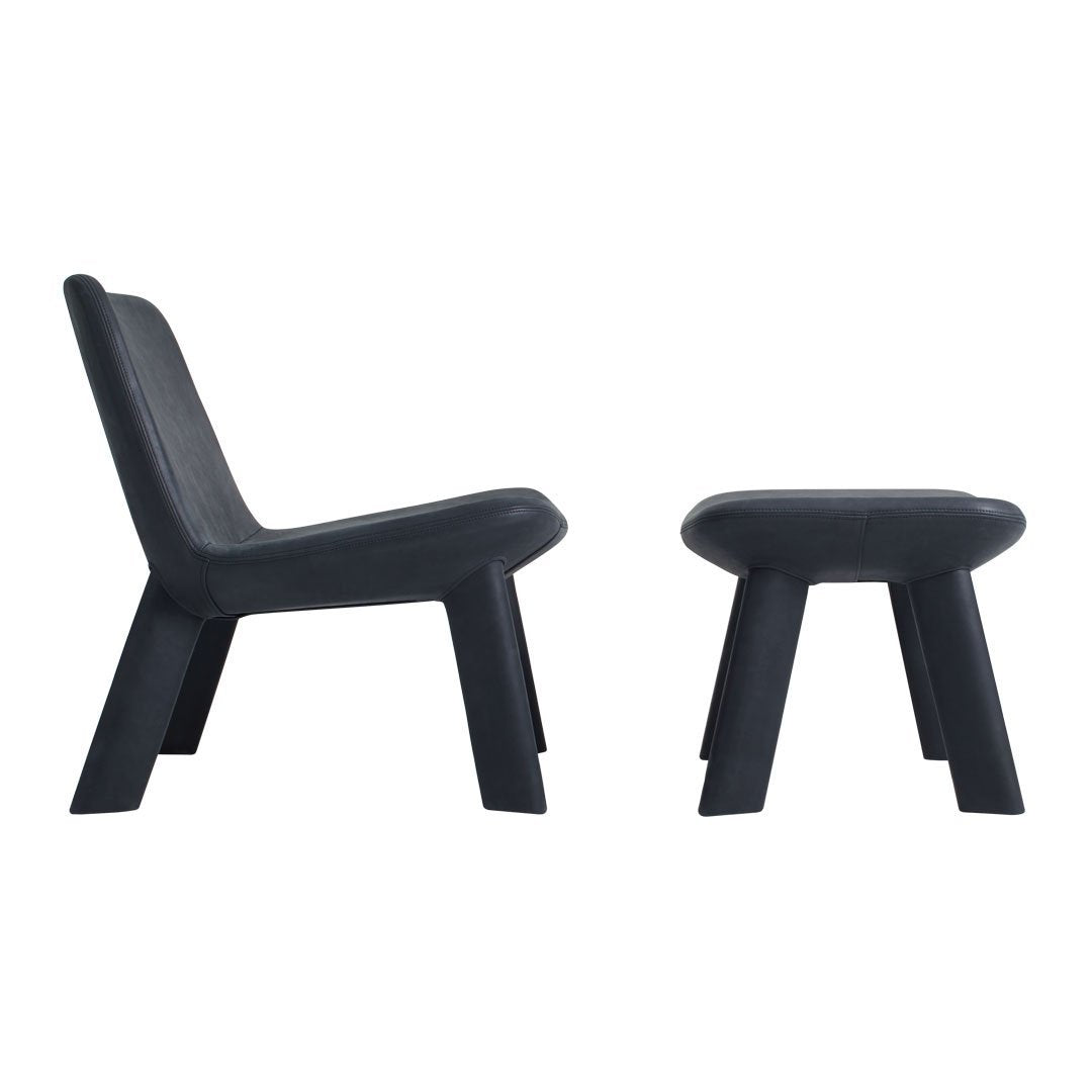Stylish black lounge chair and matching ottoman set with sleek, minimalist design and smooth surface.